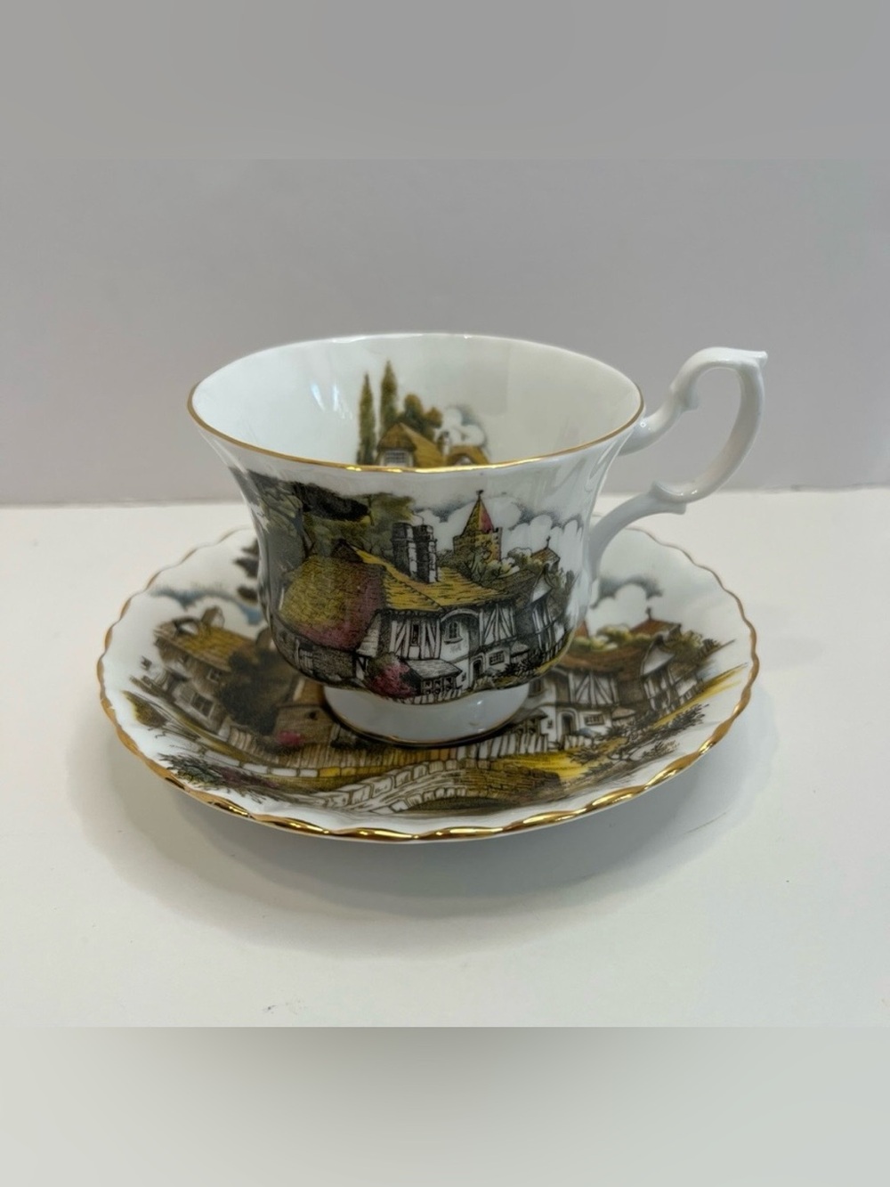 ROYAL ALBERT footed tea cup and saucer bone china England cottage print